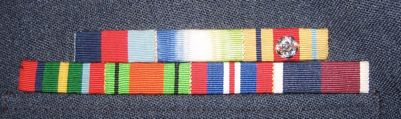 Ribbon medals: Top row: 1939-1945 Star, Atlantic Star, Africa Star (with North Africa 1942-43 clasp, for Navy service).
Second row: Pacific Star, Defence Medal, War Medal 1939&ndash;1945, RAF Long Service and Good Conduct.